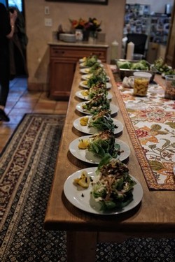 Table with Thomas Hill Organics salad