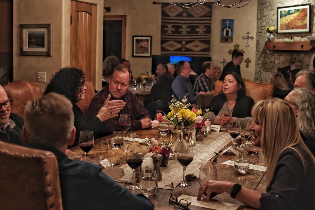 Full Moon Dinner - table with guests and wine